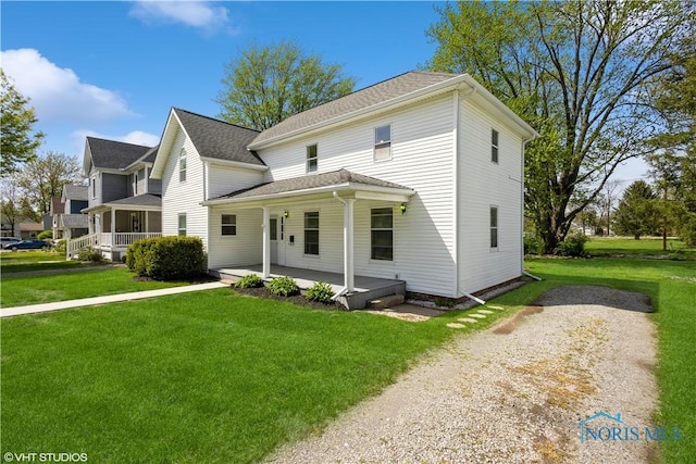 view of front of property featuring a porch and a front yard