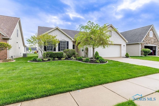 26328 Stillwater Dr, Perrysburg, OH 43551 - view of front of property with concrete driveway, a garage, a front yard, brick siding, and central air condition unit