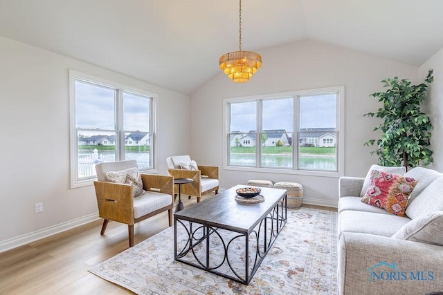 26328 Stillwater Dr, Perrysburg, OH 43551 - living room with vaulted ceiling, light wood finished floors, and baseboards