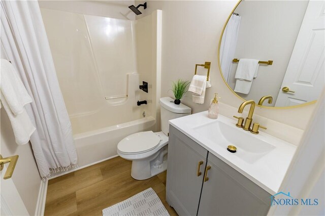 26328 Stillwater Dr, Perrysburg, OH 43551 - full bathroom with wood finished floors, shower / tub combo, vanity, and toilet