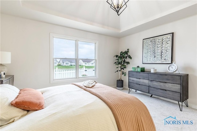 26328 Stillwater Dr, Perrysburg, OH 43551 - bedroom featuring light colored carpet, baseboards, and a raised ceiling