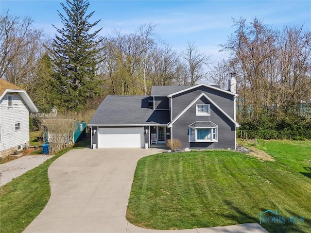 1020 Michigan Ave, Waterville, OH 43566 - view of front of house with driveway, an attached garage, a chimney, and a front yard