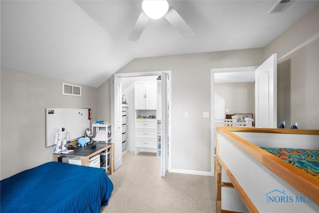 bedroom featuring visible vents, ceiling fan, vaulted ceiling, and light colored carpet