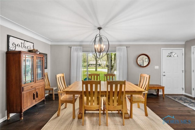 dining room with baseboards, dark wood-style flooring, and a chandelier