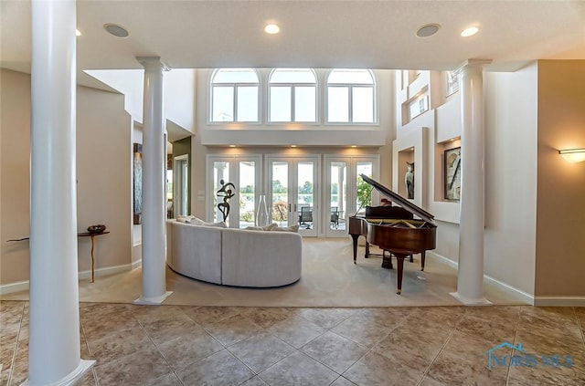 living room with ornate columns, recessed lighting, and a wealth of natural light