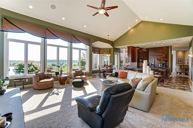 living room featuring recessed lighting, ceiling fan, light carpet, and high vaulted ceiling
