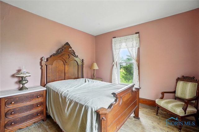 13707 Brint Rd, Berkey, OH 43504 - bedroom with wood finished floors and baseboards