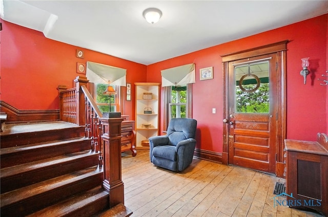 13707 Brint Rd, Berkey, OH 43504 - foyer featuring stairs and light wood-type flooring