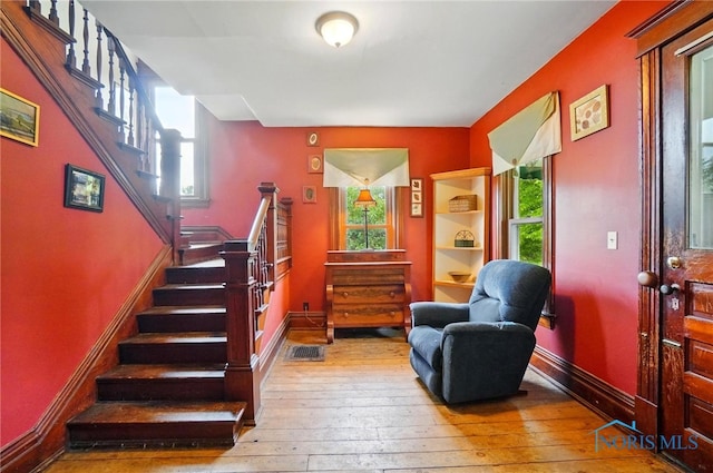 13707 Brint Rd, Berkey, OH 43504 - foyer entrance with wood-type flooring, stairs, and plenty of natural light