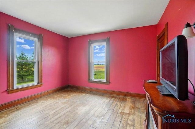 13707 Brint Rd, Berkey, OH 43504 - unfurnished office with baseboards and hardwood / wood-style floors
