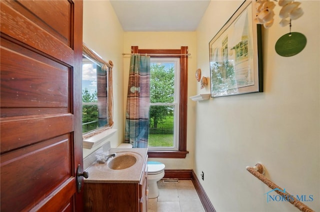 13707 Brint Rd, Berkey, OH 43504 - half bathroom featuring toilet, vanity, baseboards, and tile patterned flooring