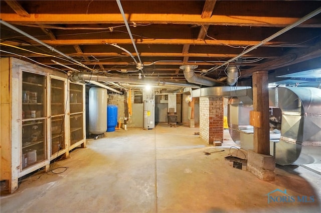 13707 Brint Rd, Berkey, OH 43504 - unfinished basement featuring water heater and a water pressure tank