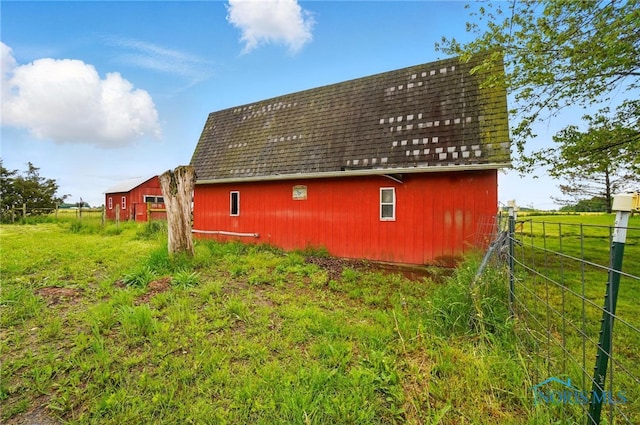 13707 Brint Rd, Berkey, OH 43504 - view of home's exterior featuring a barn, an outdoor structure, and a shingled roof