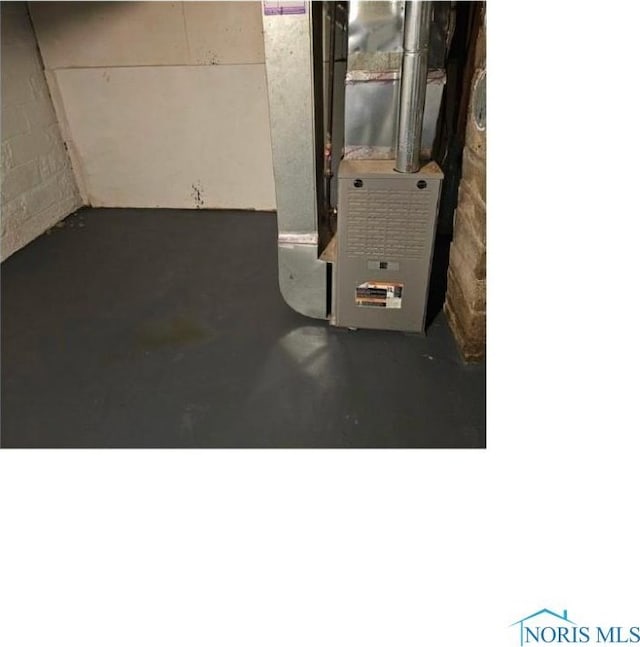 utility room with heating unit