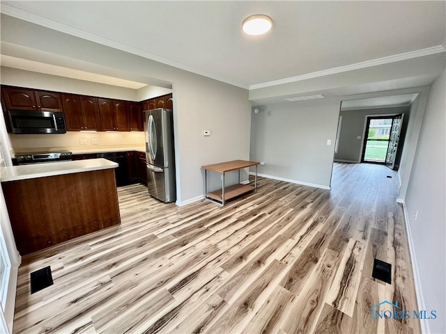 kitchen featuring dark brown cabinetry, light wood finished floors, light countertops, stainless steel appliances, and ornamental molding