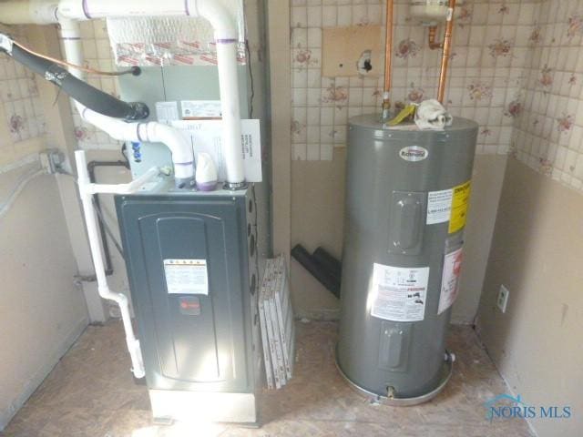utility room featuring electric water heater