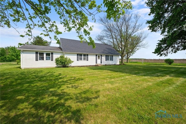 5788 Emerson Rd, Bloomdale, OH 44817 - rear view of property with a lawn