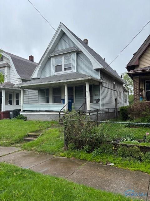 view of front of property with a porch and a chimney