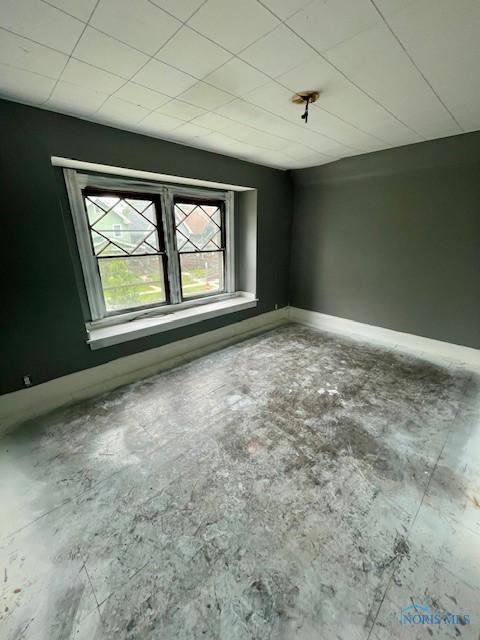 631 Clark St, Toledo, OH 43605 - empty room featuring baseboards and concrete floors