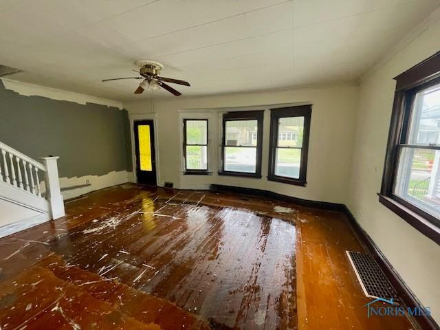 631 Clark St, Toledo, OH 43605 - empty room with hardwood / wood-style floors and a ceiling fan