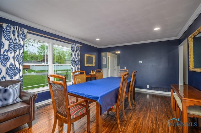 dining area featuring visible vents, wood finished floors, baseboards, ornamental molding, and recessed lighting
