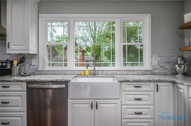 kitchen with open shelves, decorative backsplash, white cabinets, a sink, and dishwasher