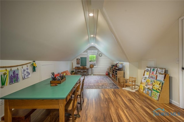 playroom featuring baseboards, wood finished floors, and lofted ceiling