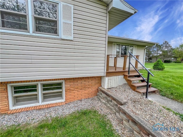 view of side of property with a yard