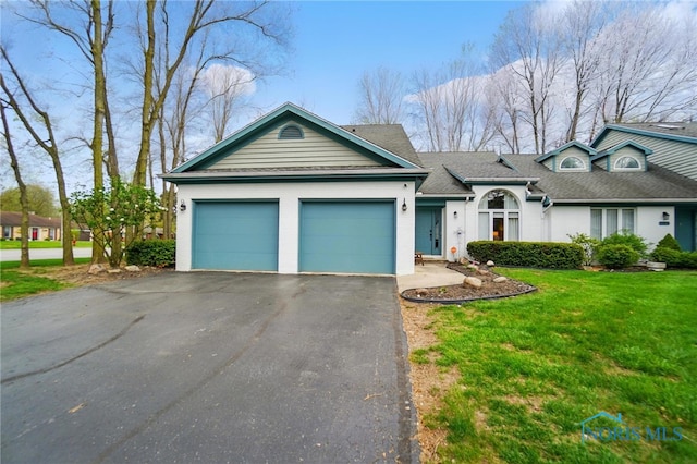 single story home featuring a garage, aphalt driveway, roof with shingles, and a front yard