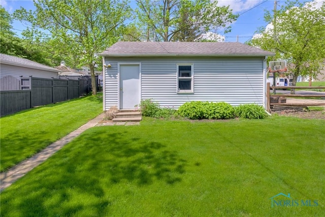 229 E Harrison St, Maumee, OH 43537 - view of outdoor structure with a fenced backyard and entry steps