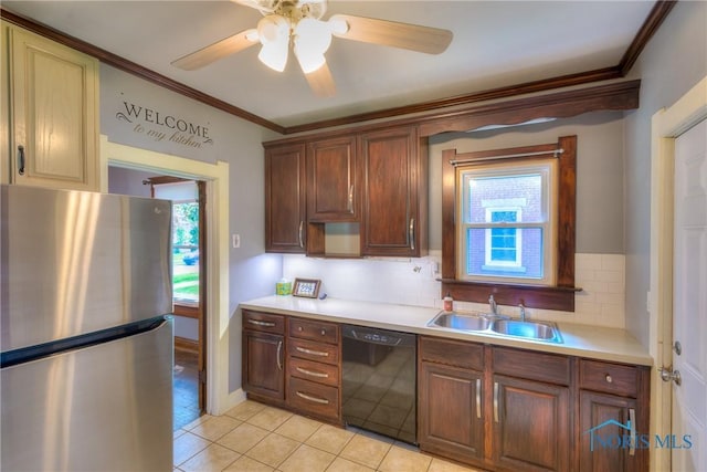 229 E Harrison St, Maumee, OH 43537 - kitchen featuring a sink, freestanding refrigerator, black dishwasher, light tile patterned flooring, and ornamental molding