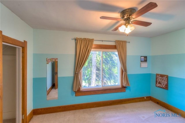 229 E Harrison St, Maumee, OH 43537 - carpeted spare room with baseboards and a ceiling fan