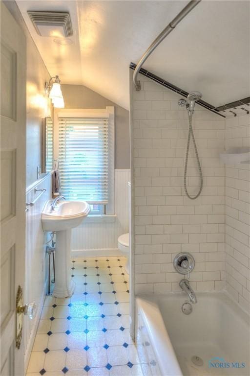 229 E Harrison St, Maumee, OH 43537 - bathroom with toilet, bathtub / shower combination, visible vents, wainscoting, and vaulted ceiling