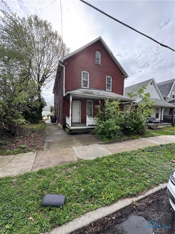 364 Burger St, Toledo, OH 43605 - view of front of property with a porch and brick siding