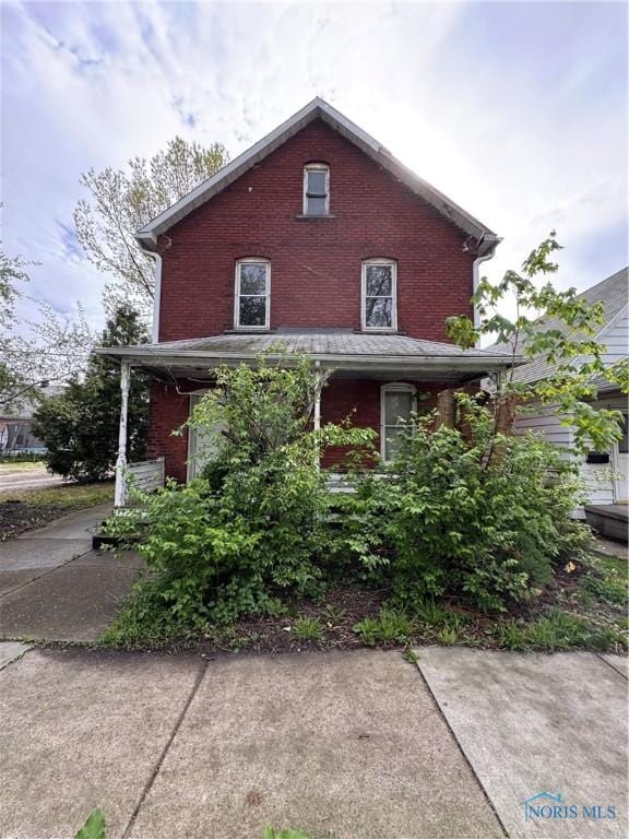 364 Burger St, Toledo, OH 43605 - view of front of property featuring brick siding and a porch
