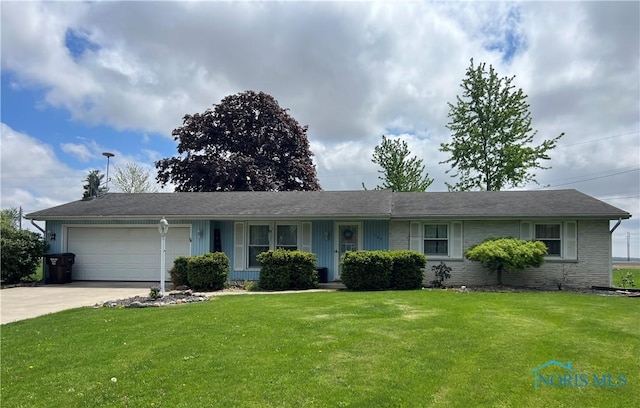 single story home with a front lawn, driveway, and an attached garage