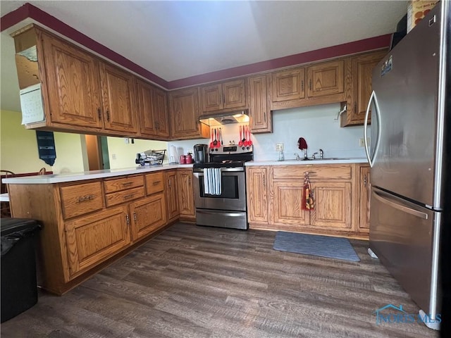 107 Oak Park Dr, Hicksville, OH 43526 - kitchen with stainless steel appliances, a sink, dark wood-type flooring, and light countertops