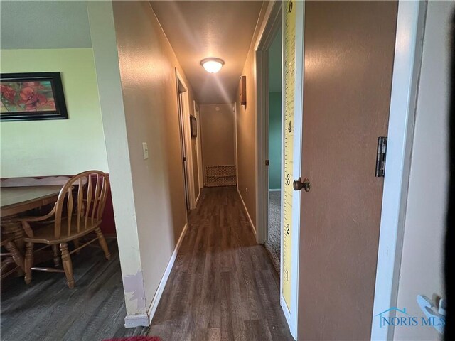 107 Oak Park Dr, Hicksville, OH 43526 - corridor featuring dark wood-style flooring and baseboards