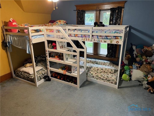 bedroom with carpet floors and baseboards