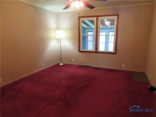 empty room featuring carpet, baseboards, a ceiling fan, and ornamental molding
