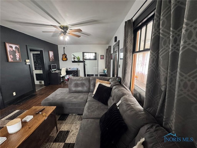 living room with a ceiling fan and wood finished floors