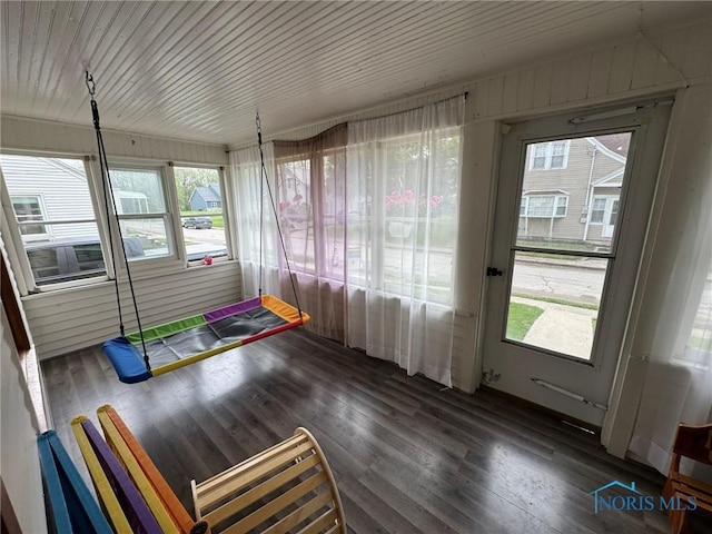 unfurnished sunroom with a wealth of natural light
