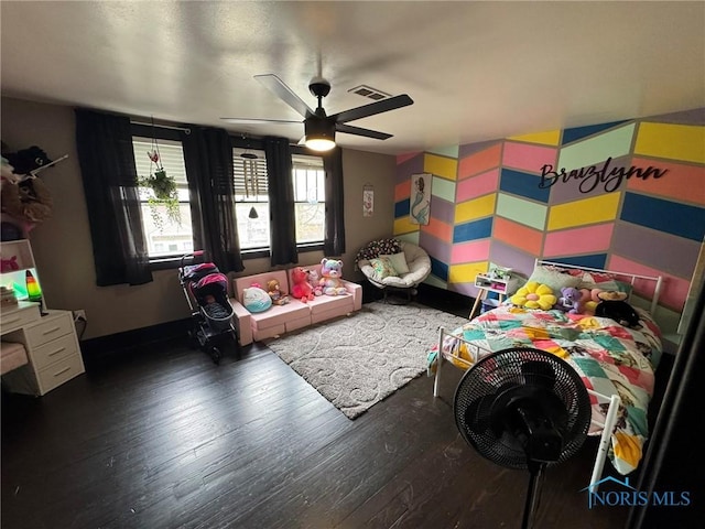 bedroom featuring ceiling fan, hardwood / wood-style flooring, and visible vents