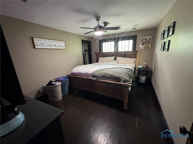 bedroom with wood finished floors and a ceiling fan