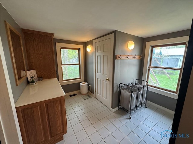 bathroom featuring tile patterned floors and baseboards