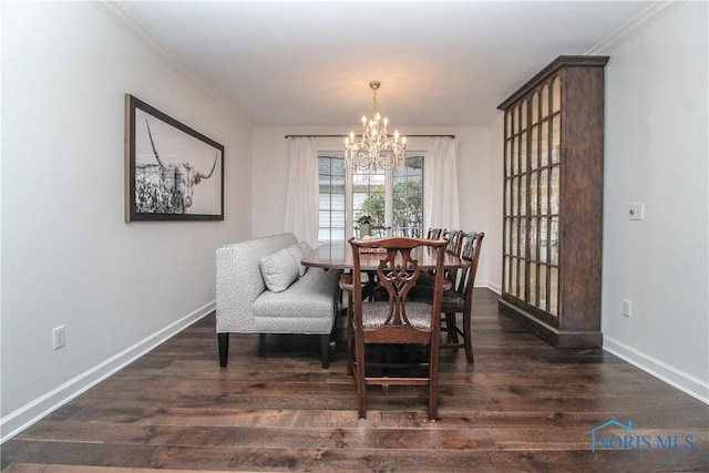 dining area with baseboards, a chandelier, crown molding, and wood finished floors