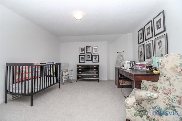 carpeted bedroom with baseboards