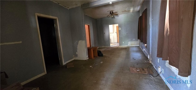 interior space featuring baseboards