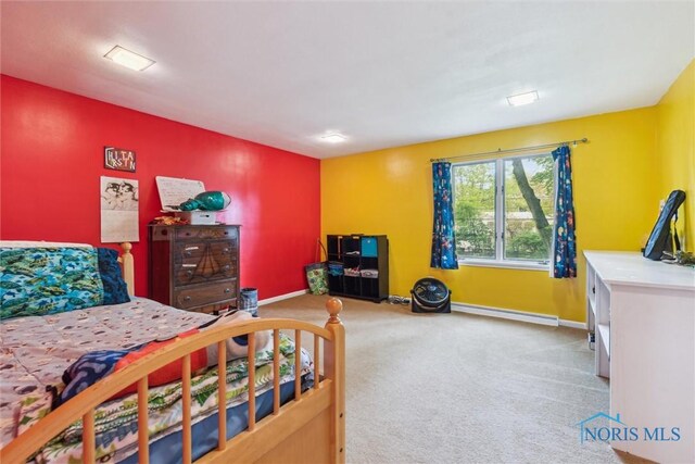 3448 Corey Rd, Toledo, OH 43615 - bedroom featuring baseboard heating, carpet, and baseboards