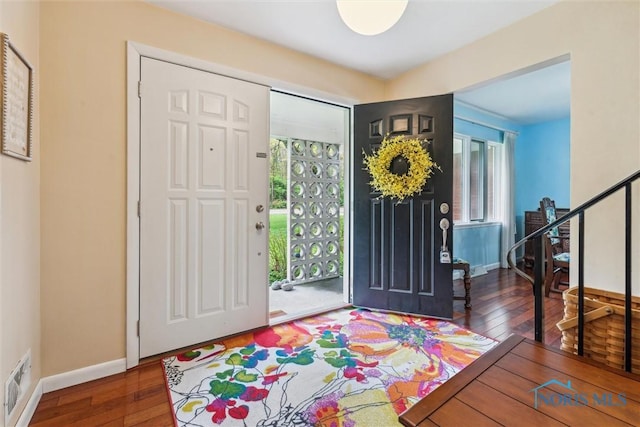 3448 Corey Rd, Toledo, OH 43615 - foyer featuring stairs, wood-type flooring, and baseboards